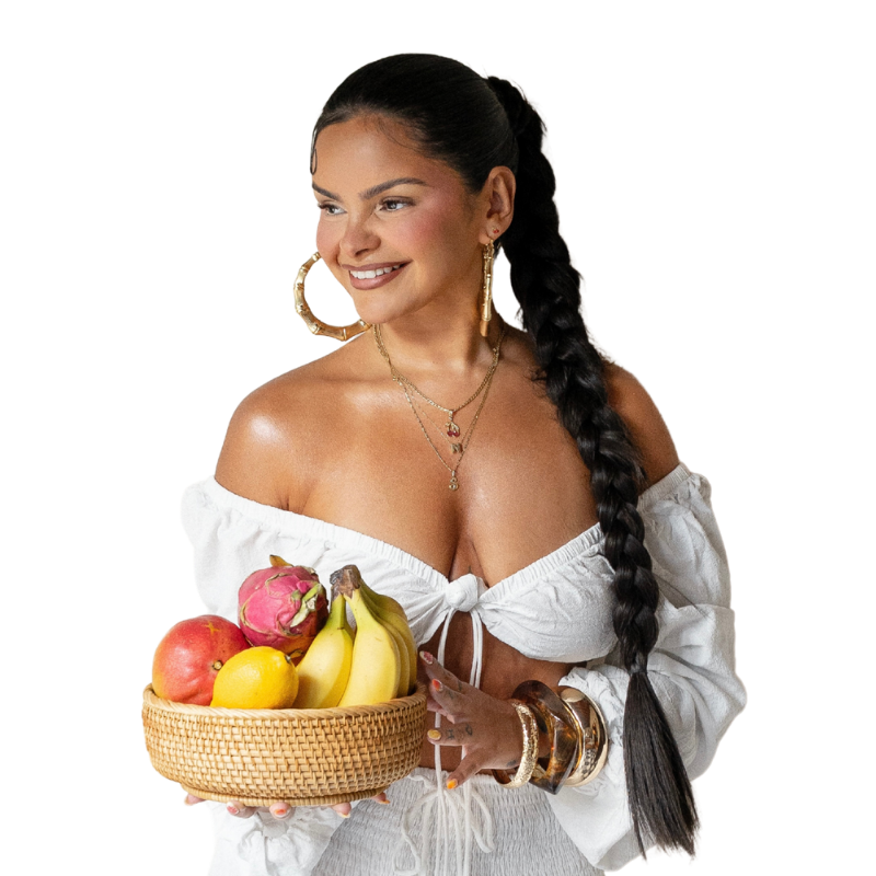 Confidence Mentor Nicole radiates joy and power with her all white ensemble and fruit basket.